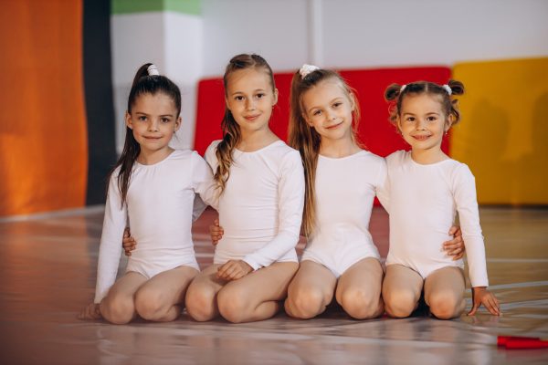 Group of girls exercising at gymnastic school